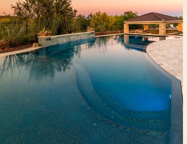 An illustration of a sizable backyard hot tub design with natural stones