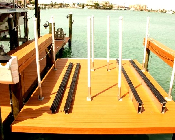 Example of a large backyard dock in the beach style with an addition to the roof